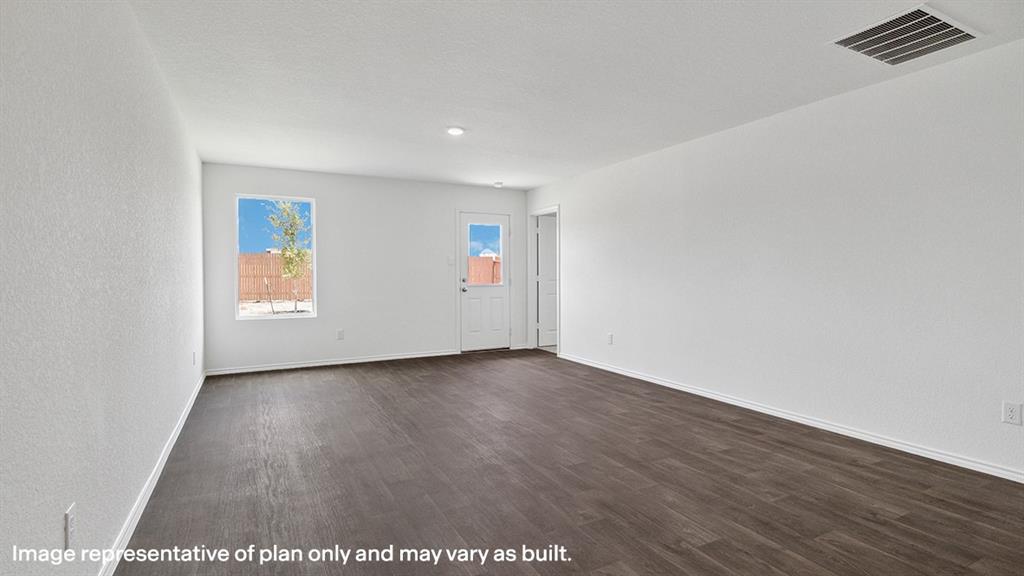 1704 Fawn Crk Drive Blue Ridge, TX 75424 - Photo 15 of 28 an empty room with wooden floor and windows