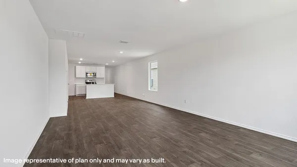 a view of a kitchen with a sink and wooden floor