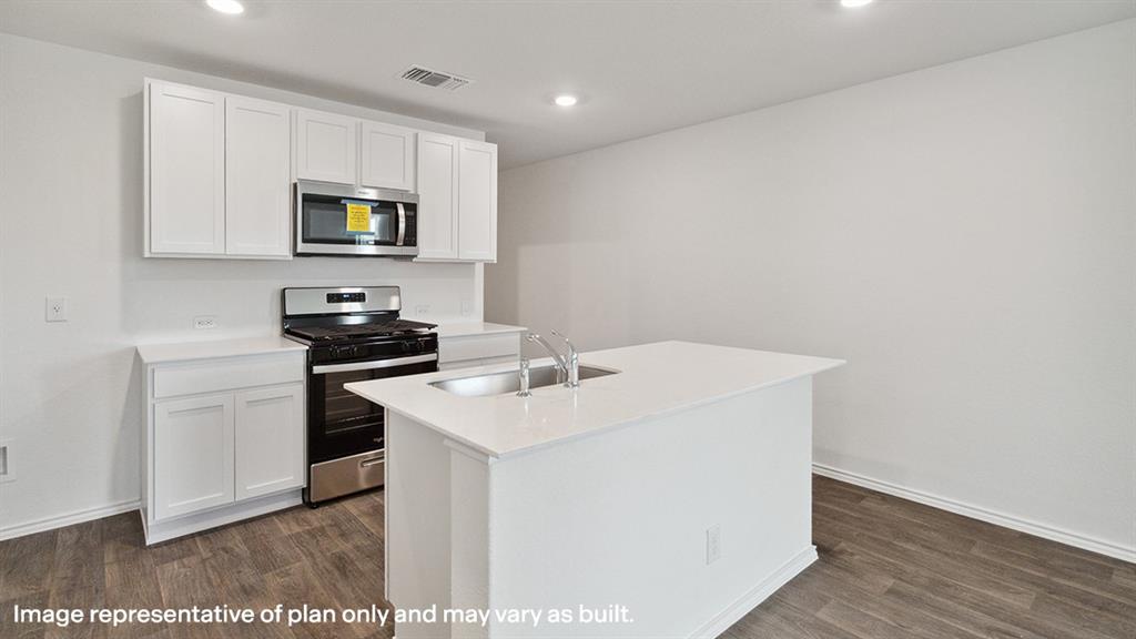 1704 Fawn Crk Drive Blue Ridge, TX 75424 - Photo 3 of 28 a kitchen with a sink a microwave and cabinets