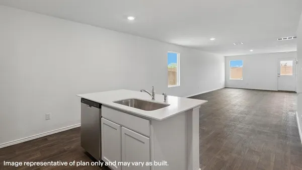 a kitchen with a sink and cabinets