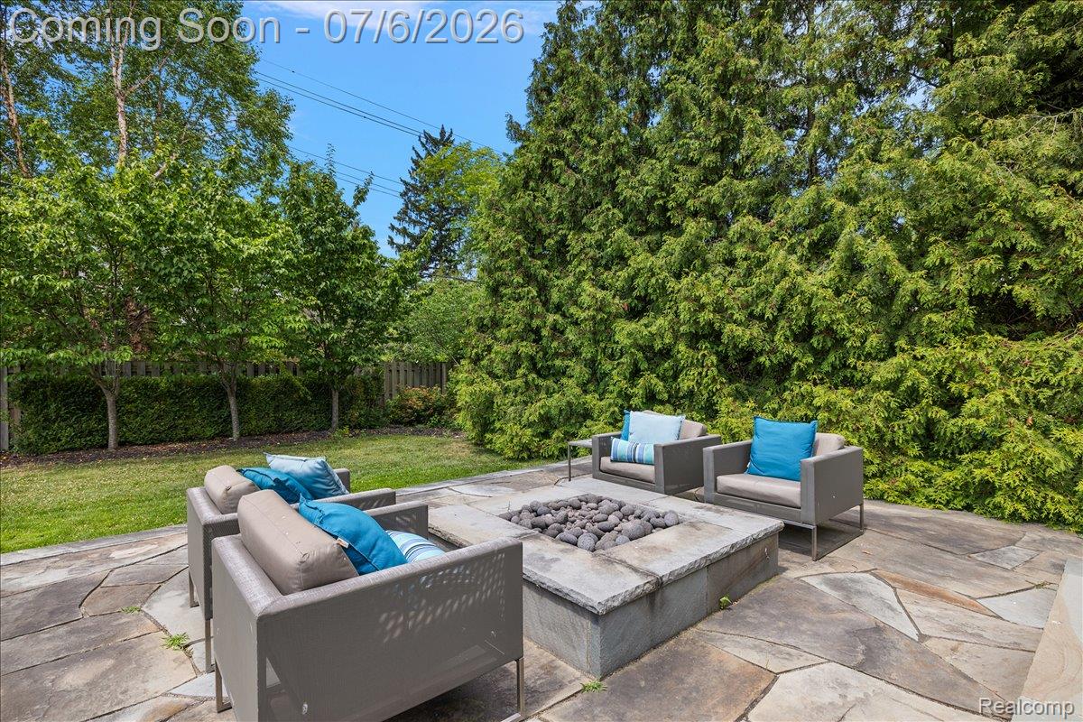 1051 Devonshire Road Grosse Pointe, MI 48230 - Photo 85 of 98 Expansive natural stone patio featuring a built-in fire pit with stone surround