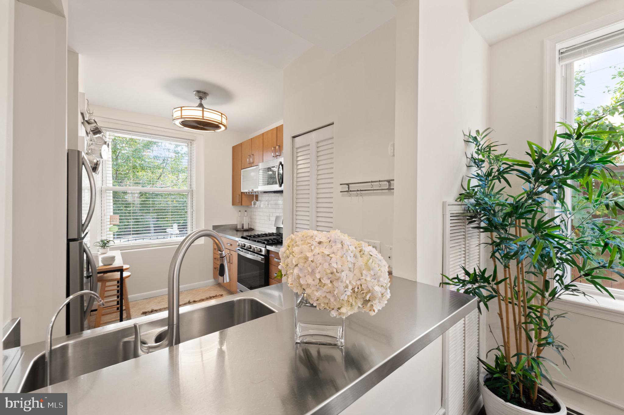 1641 V Street Northwest Washington, DC 20009 - Photo 12 of 36 a view of a dining room with furniture window and outside view