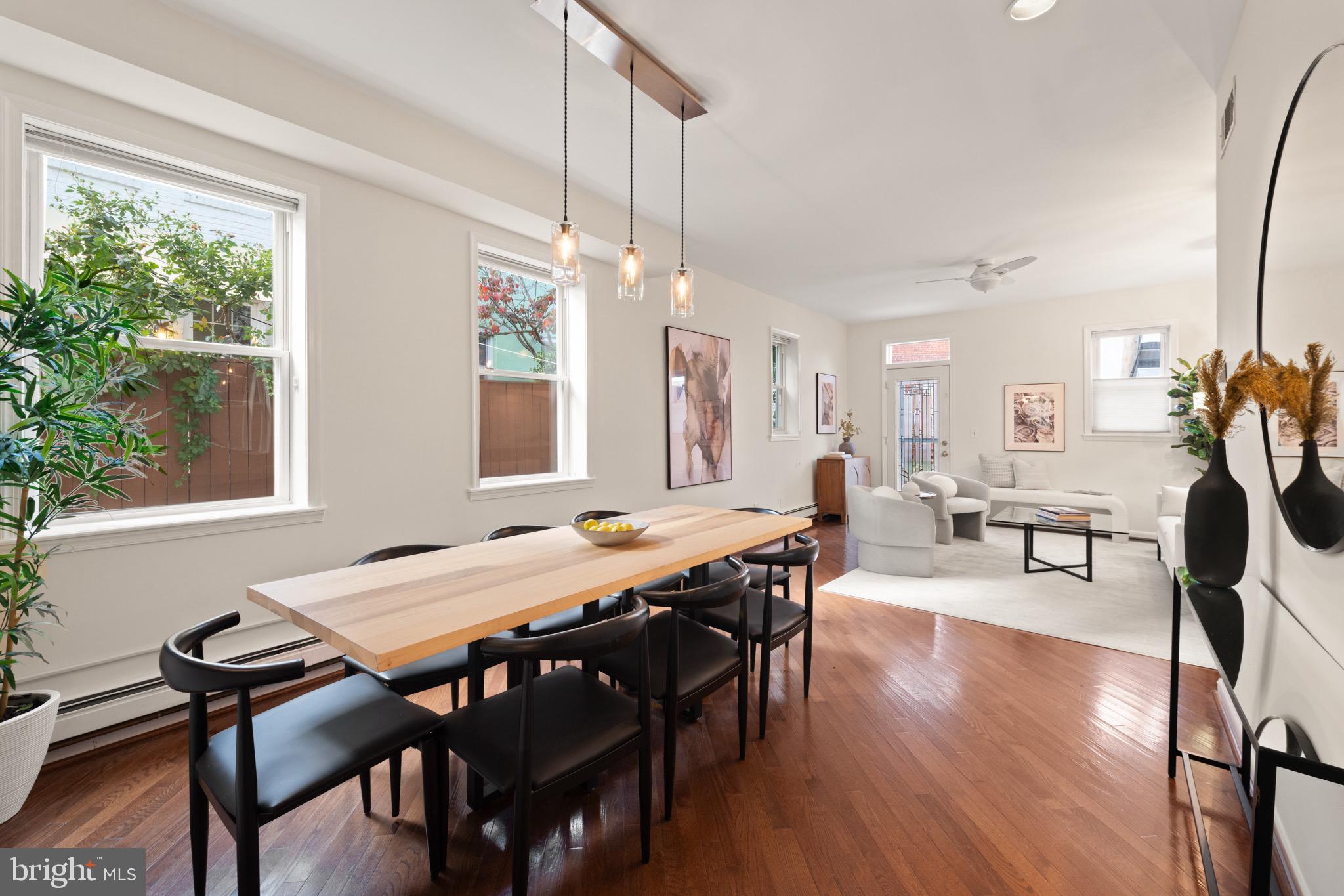 1641 V Street Northwest Washington, DC 20009 - Photo 14 of 36 a view of a dining room with furniture window and wooden floor