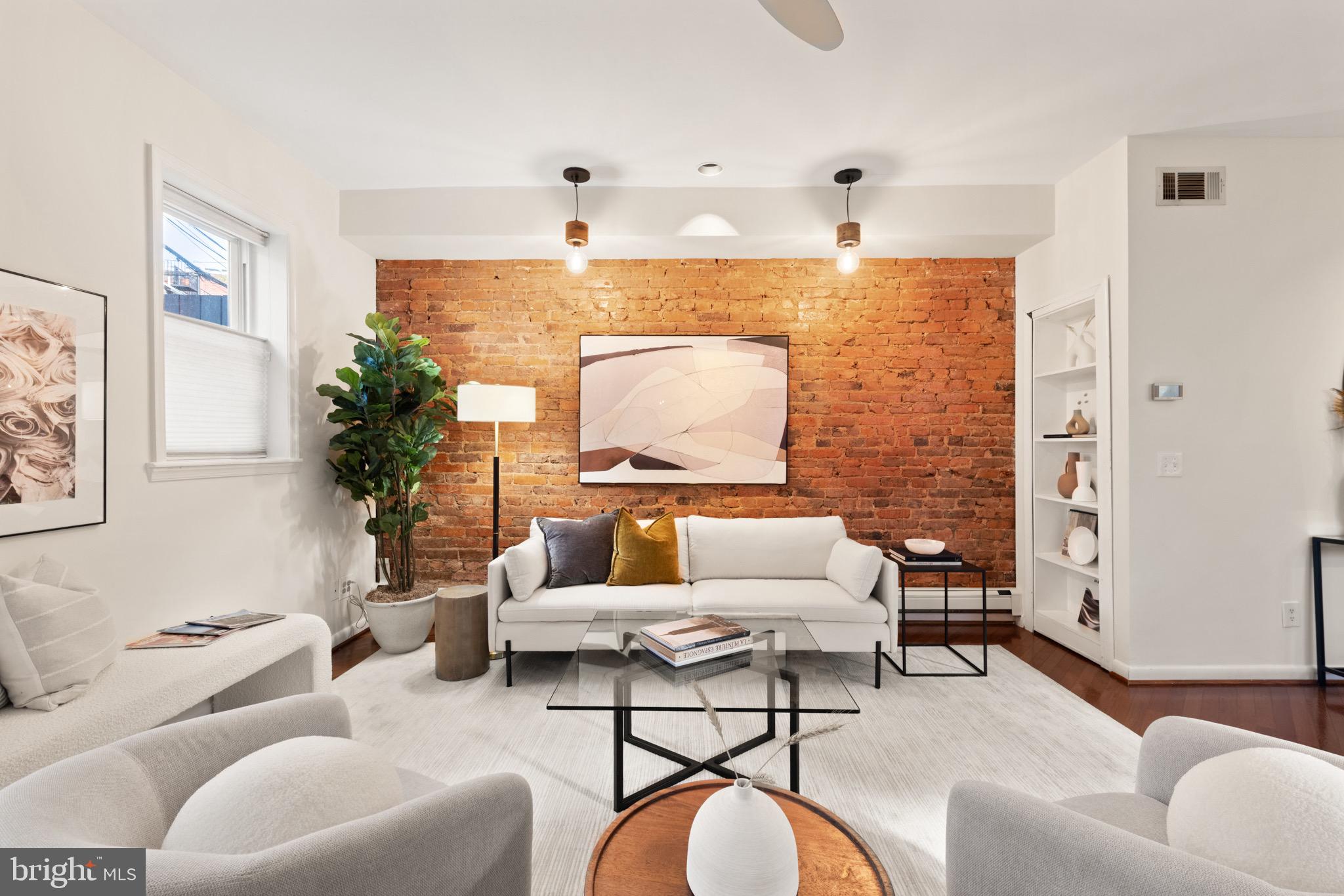 1641 V Street Northwest Washington, DC 20009 - Photo 17 of 36 a living room with furniture and a chandelier