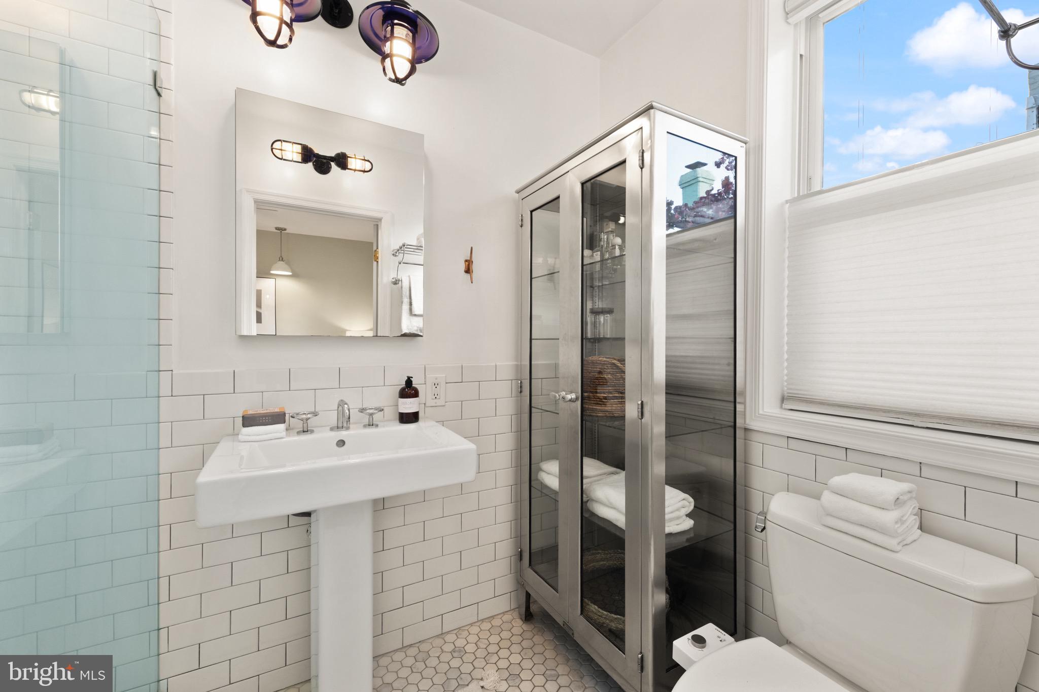 1641 V Street Northwest Washington, DC 20009 - Photo 22 of 36 a bathroom with a sink toilet and shower