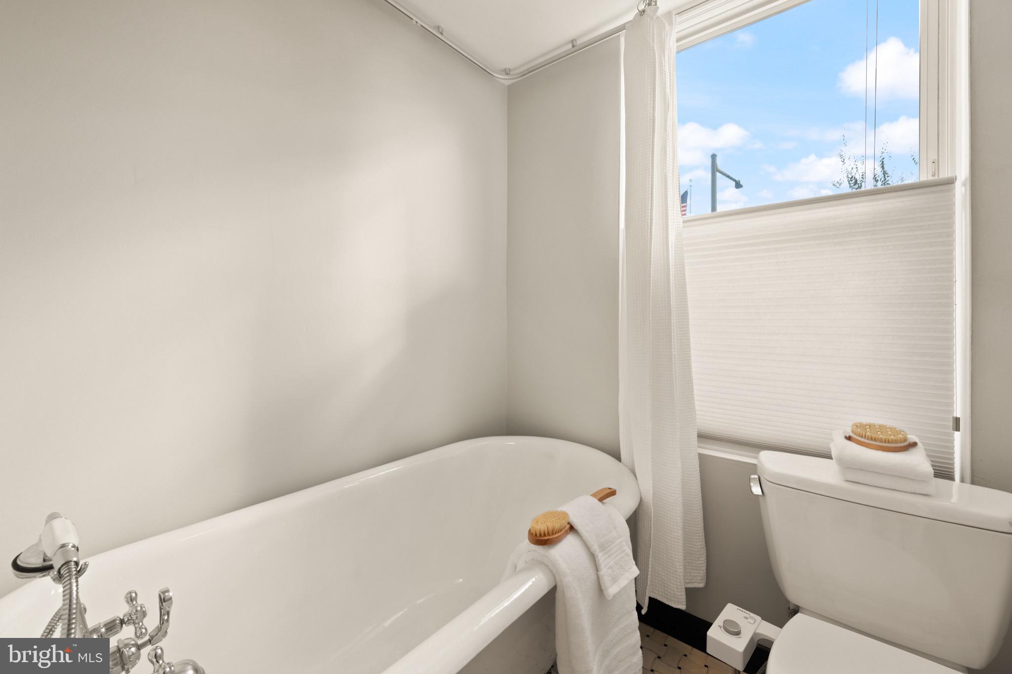 1641 V Street Northwest Washington, DC 20009 - Photo 27 of 36 a bathroom with a bathtub and toilet