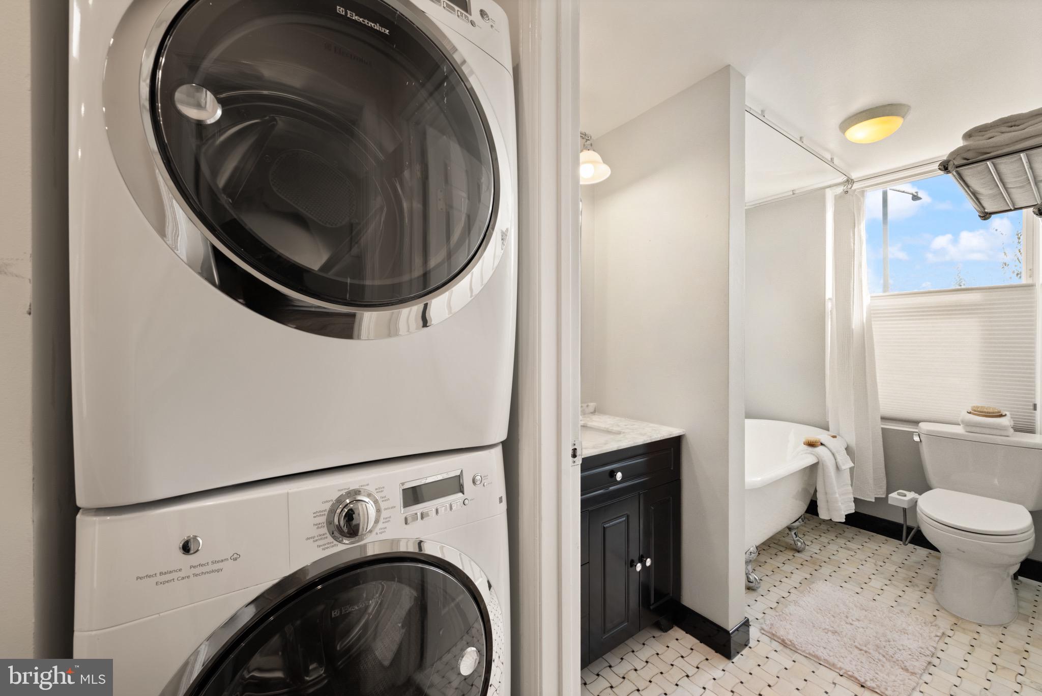 1641 V Street Northwest Washington, DC 20009 - Photo 28 of 36 a view of a hallway with washer and dryer