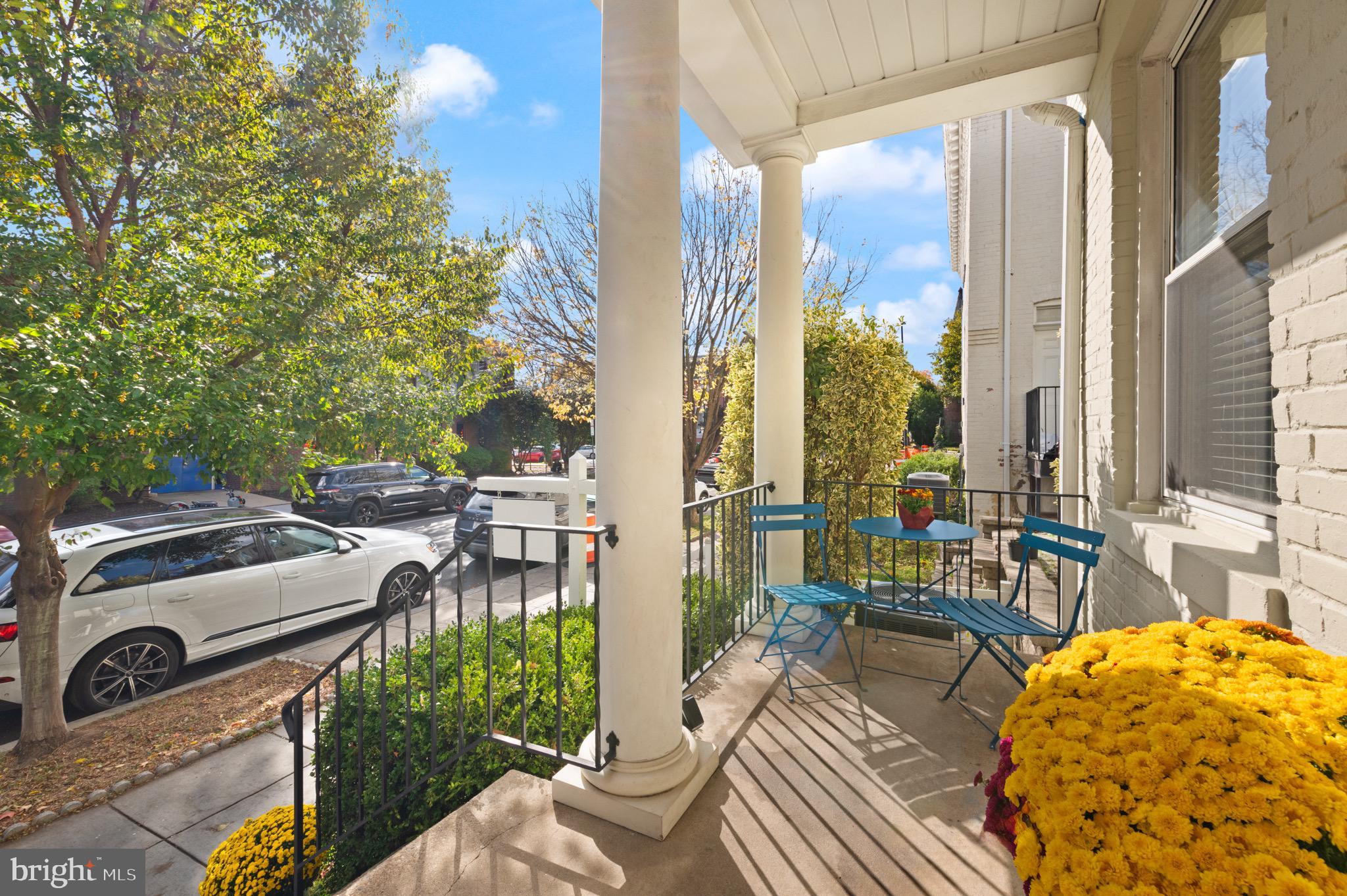 1641 V Street Northwest Washington, DC 20009 - Photo 3 of 36 a view of a patio with couches table and chairs and potted plants
