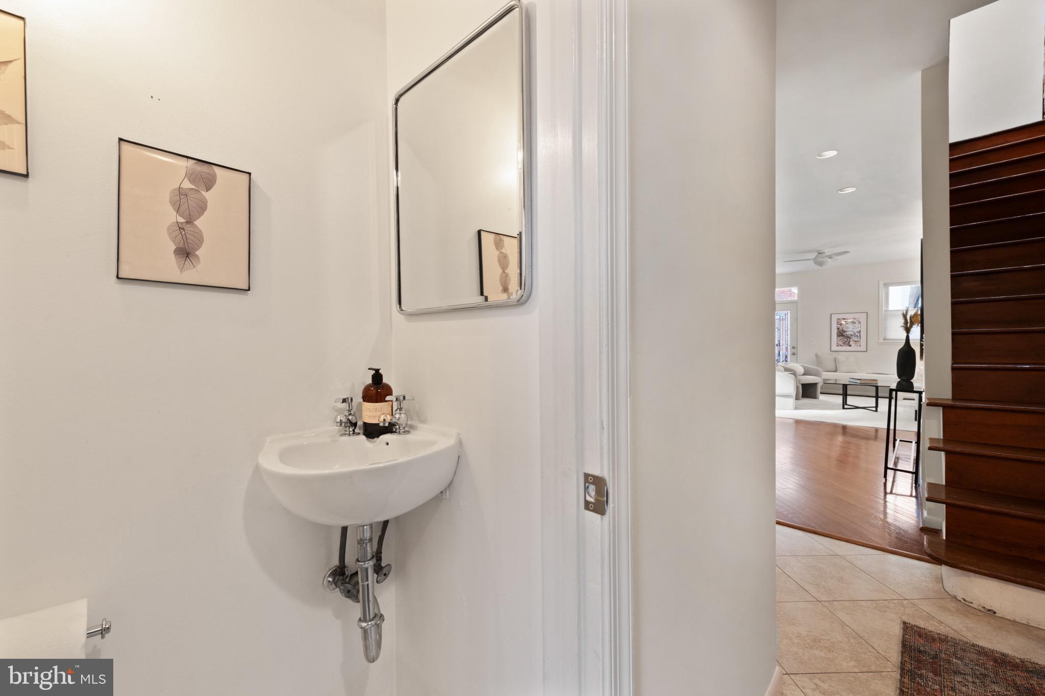 1641 V Street Northwest Washington, DC 20009 - Photo 8 of 36 a bathroom with a sink and mirror