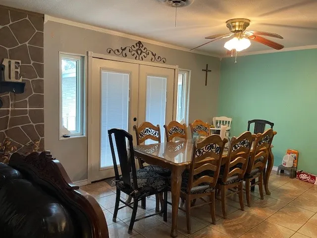 a view of a dining room with furniture and chandelier