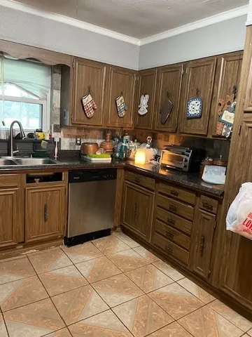 a kitchen with a sink cabinets and window