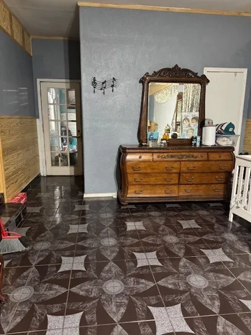 a view of bedroom with a bed and glass door