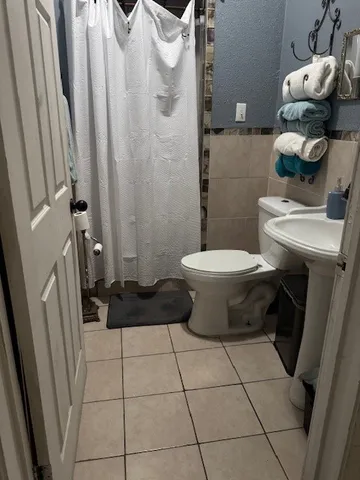 a bathroom with a toilet and a sink