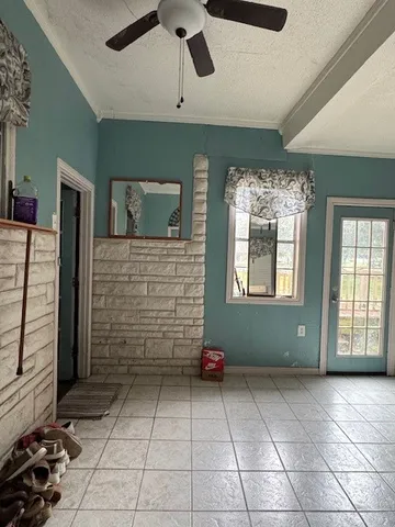 a bedroom with bed and a chandelier