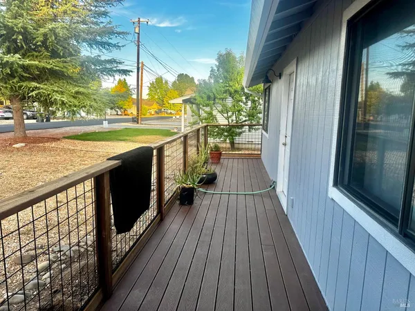 a view of balcony with wooden floor