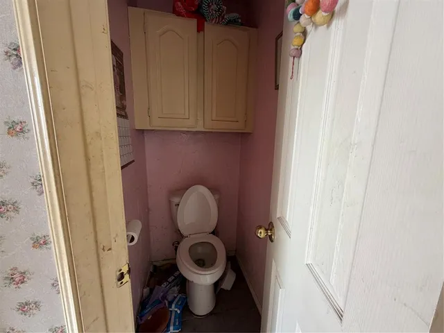 a bathroom with a toilet and a sink