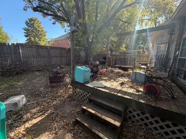 a view of a backyard with sitting area