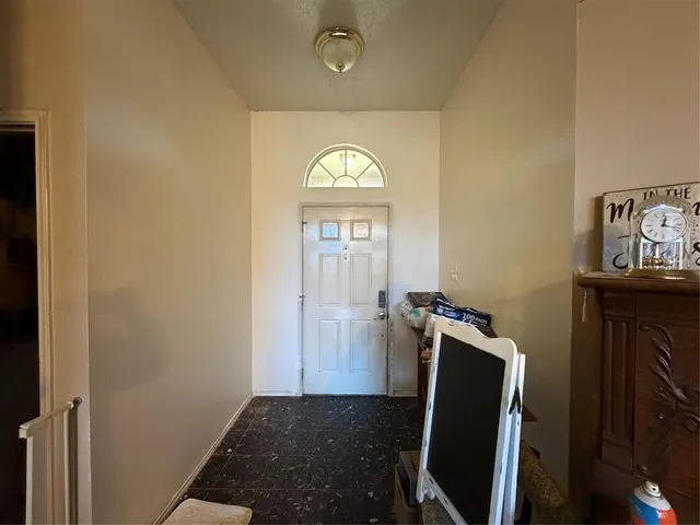 a view of an entryway with wooden floor