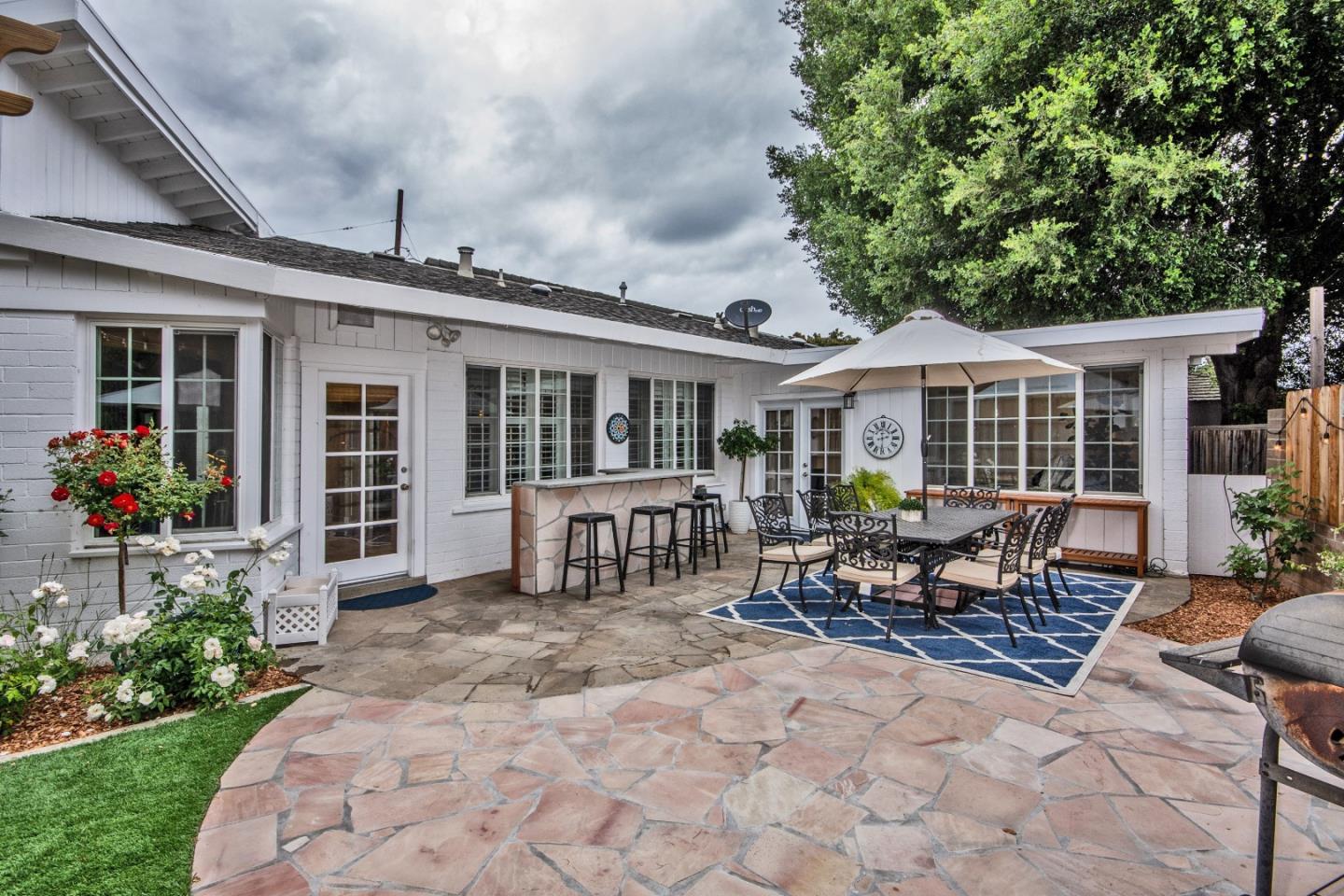 340 Jarvis Court Sunnyvale, CA 94086 - Photo 16 of 18 a front view of a house with garden and chairs