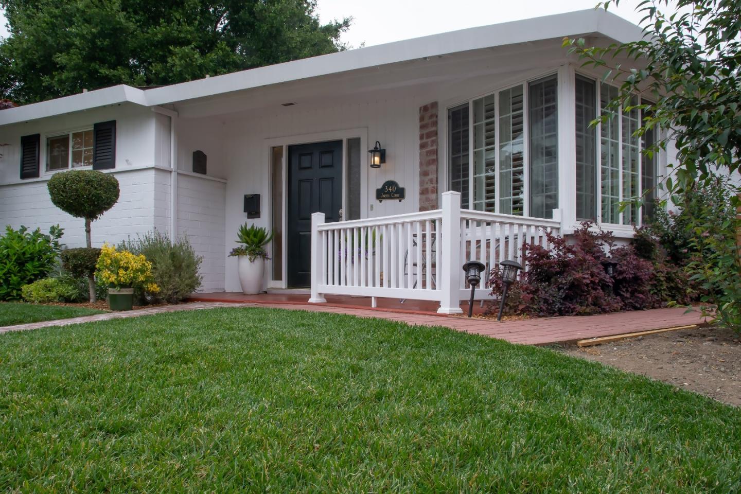 340 Jarvis Court Sunnyvale, CA 94086 - Photo 3 of 18 a view of a house with a yard and a garden