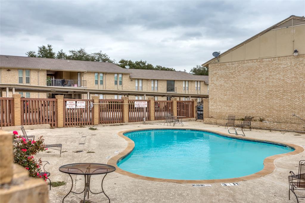 5844 Sandhurst Lane, Unit D Dallas, TX 75206 - Photo 29 of 31 a view of a house with pool and chairs