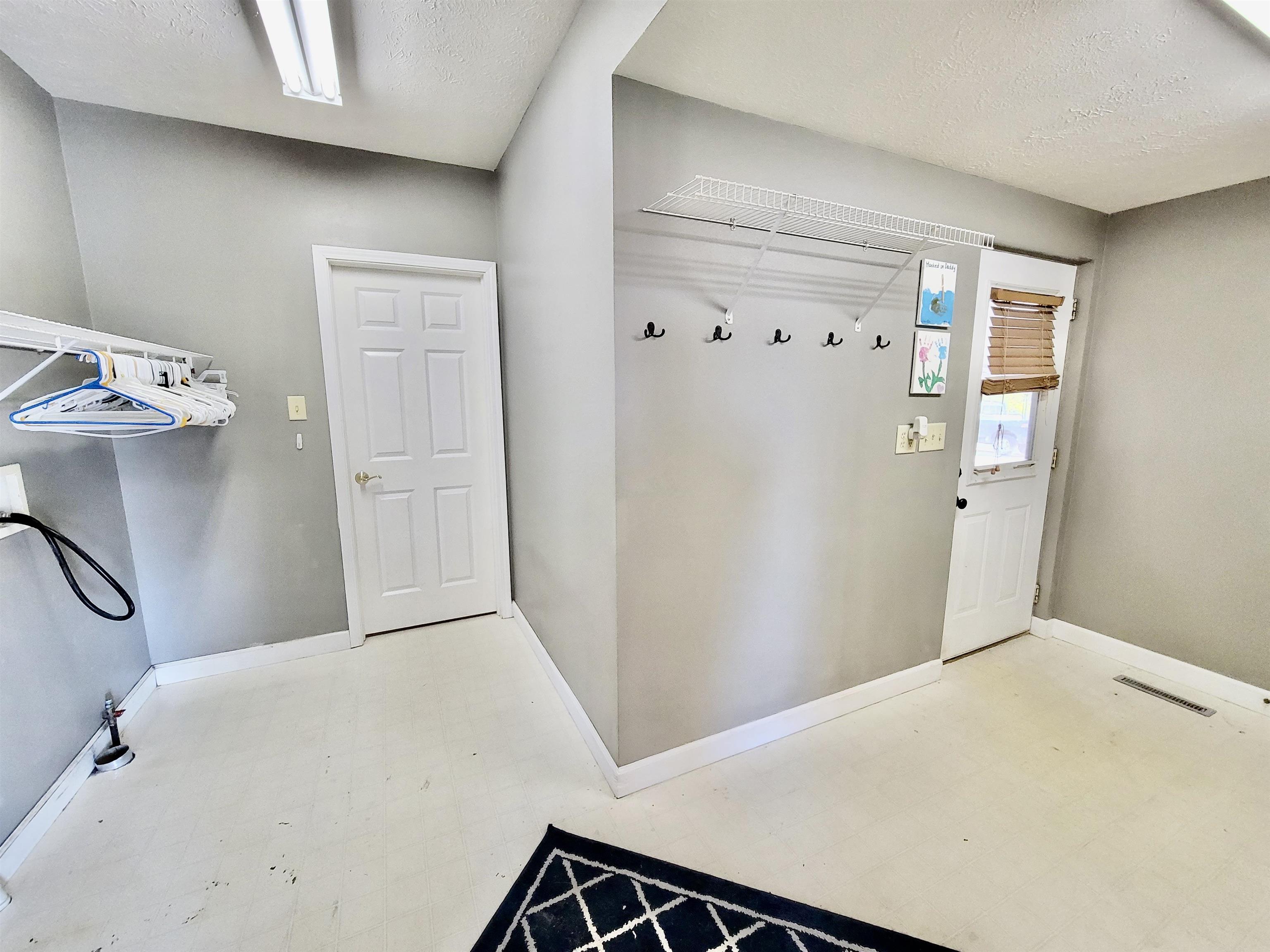 9205 East Scott Road Stillman Valley, IL 61084 - Photo 19 of 43 a view of a hallway with closet