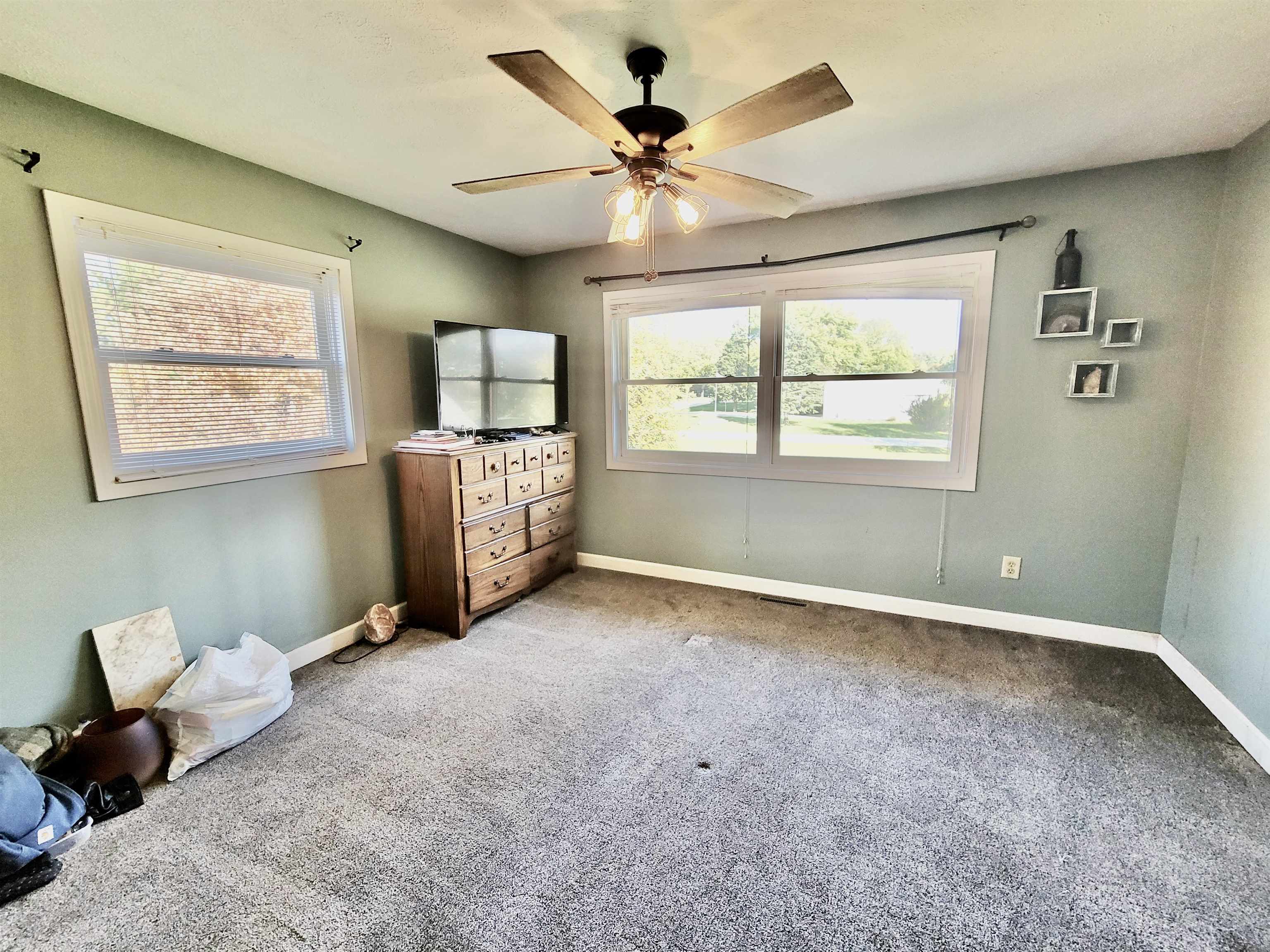 9205 East Scott Road Stillman Valley, IL 61084 - Photo 26 of 43 a living room with furniture and a window