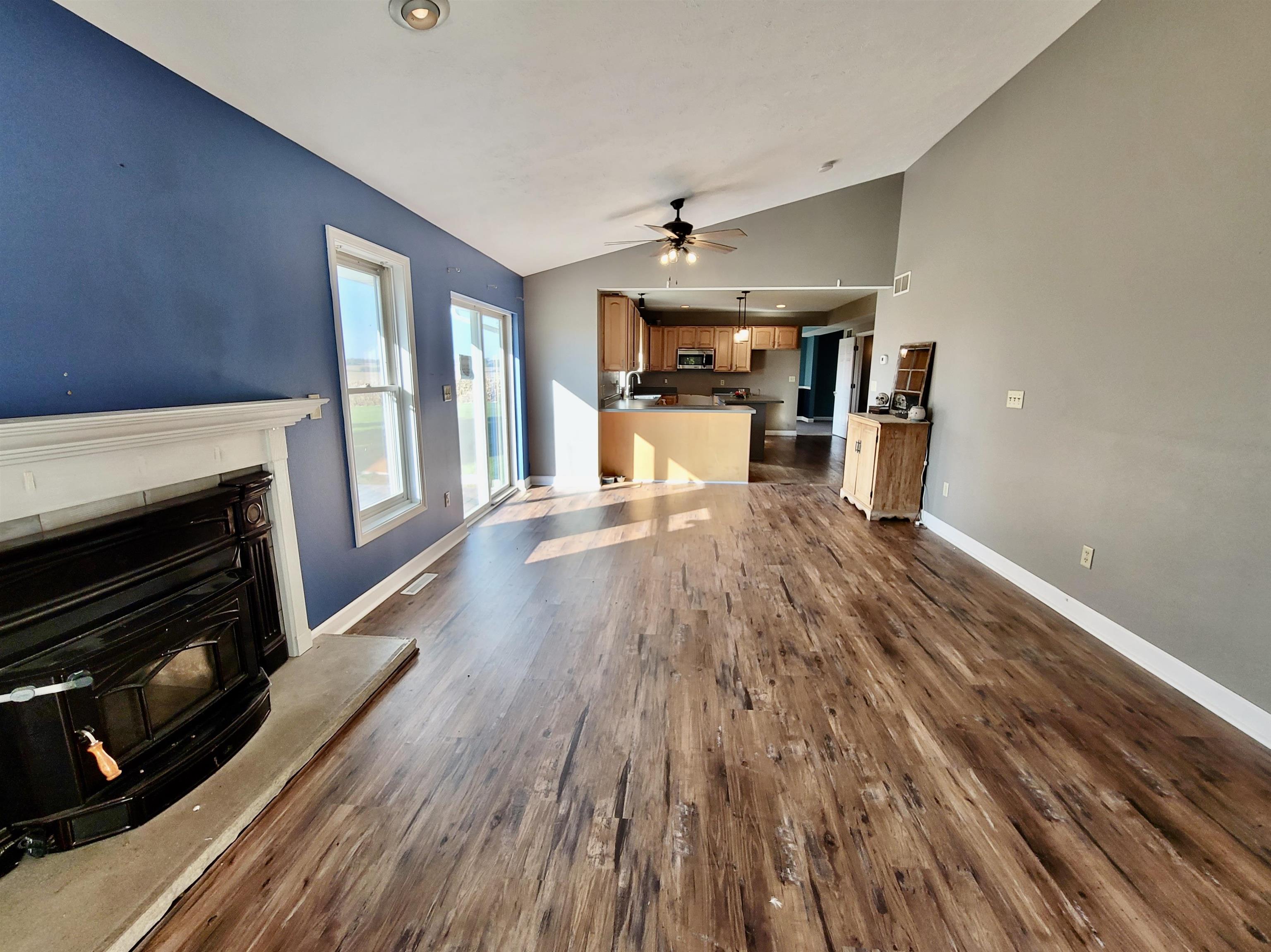 9205 East Scott Road Stillman Valley, IL 61084 - Photo 6 of 43 a living room with furniture and a fireplace