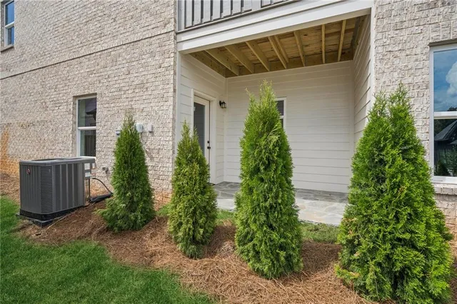 a view of an empty room with windows