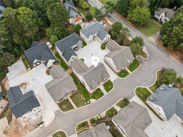 an aerial view of a house with swimming pool