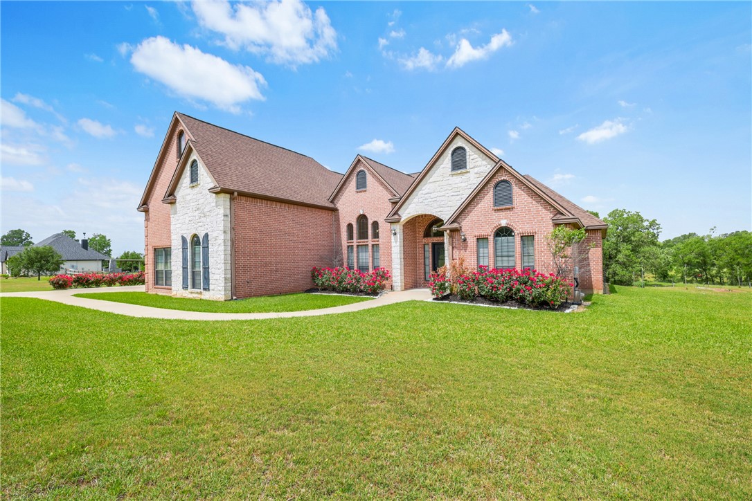 a front view of a house with garden