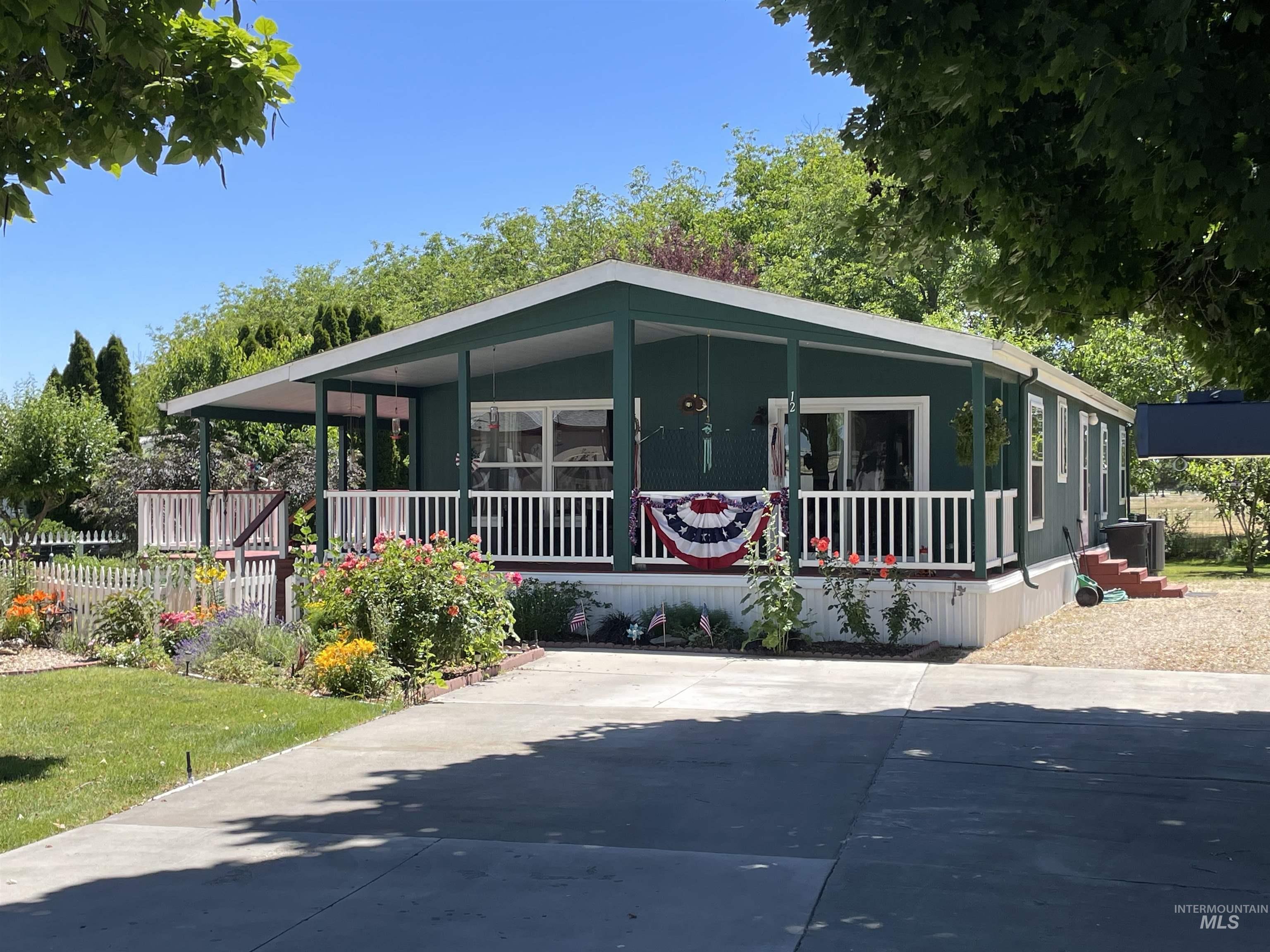 2750 Alden Road, Unit 12 12 Fruitland, ID 83619 - Photo 35 of 38 Covered front porch with white railings and recessed lighting