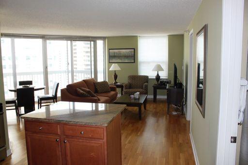 Undisclosed Address Chicago, IL 60654 - Photo 3 of 10 a living room with furniture and a large window