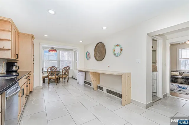 a view of living room kitchen and entryway
