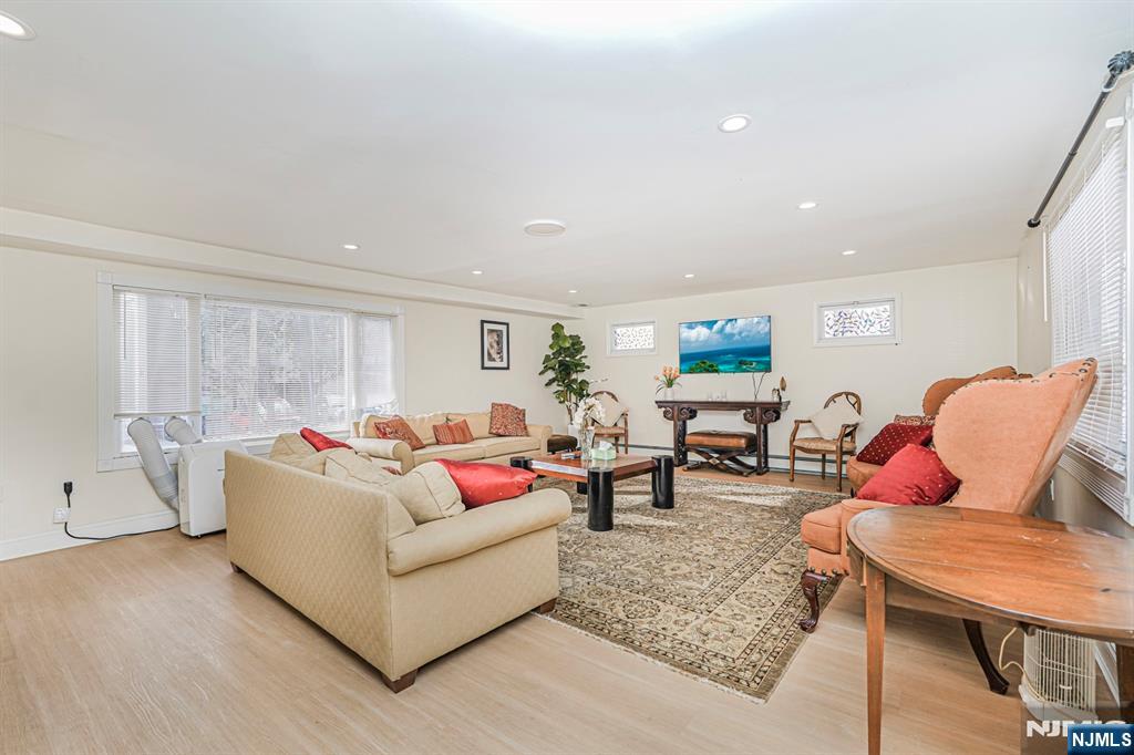 566 Teaneck Road Teaneck, NJ 07666 - Photo 17 of 35 a living room with furniture and wooden floor