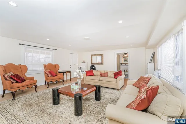 a living room with furniture and a rug