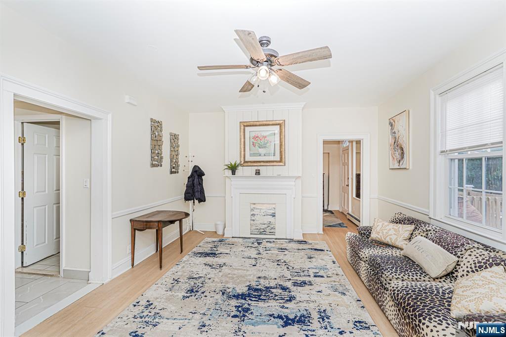 566 Teaneck Road Teaneck, NJ 07666 - Photo 22 of 35 a bedroom with a bed and a chandelier