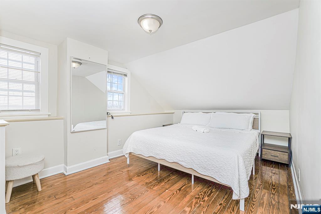 566 Teaneck Road Teaneck, NJ 07666 - Photo 23 of 35 a bedroom with a bed and a table