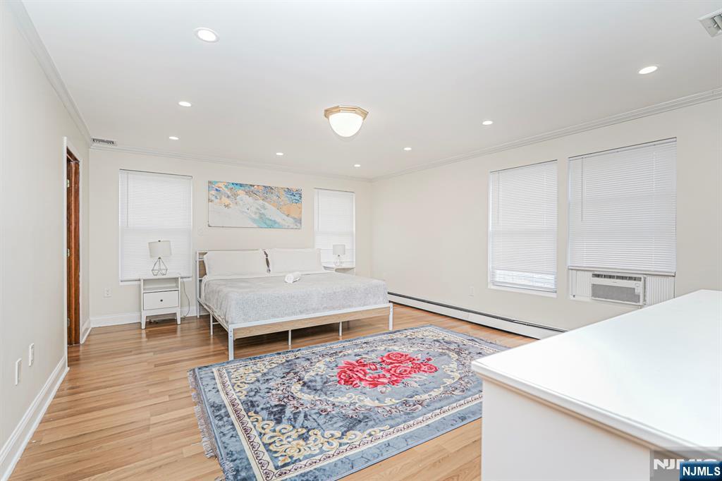 566 Teaneck Road Teaneck, NJ 07666 - Photo 27 of 35 a living room with furniture and wooden floor
