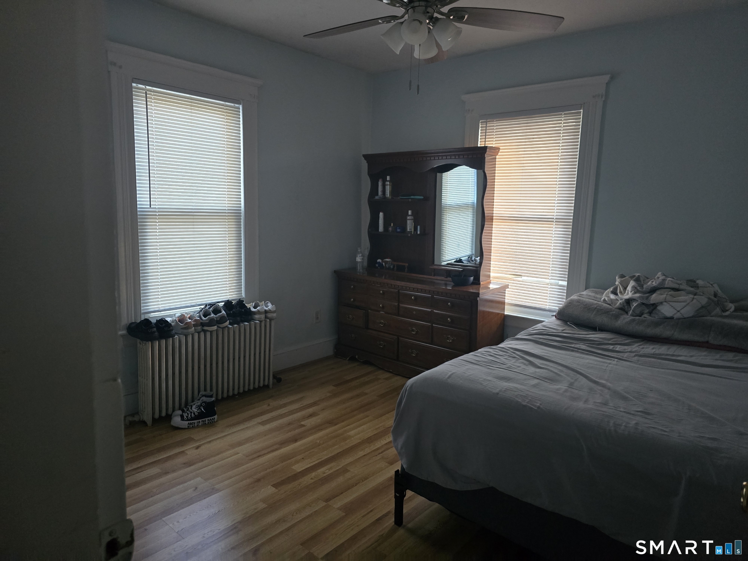 279 East Elm Street Torrington, CT 06790 - Photo 2 of 10 a bedroom with a bed and a dresser