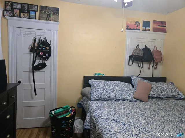 a bedroom with a bed and dresser