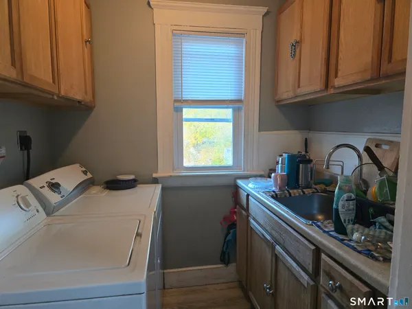 a kitchen with sink and cabinets