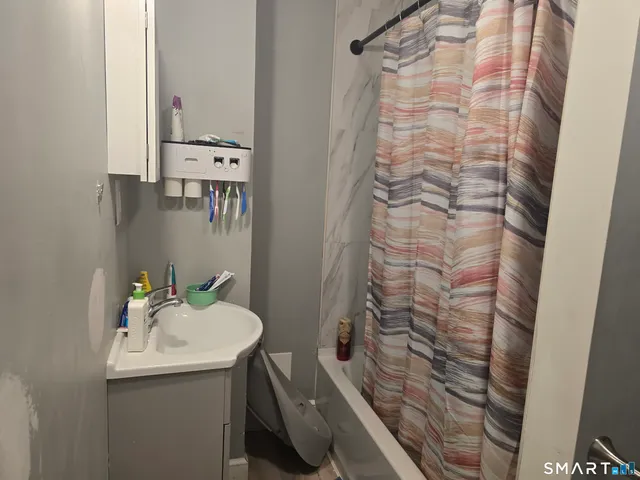 a bathroom with a sink and mirror