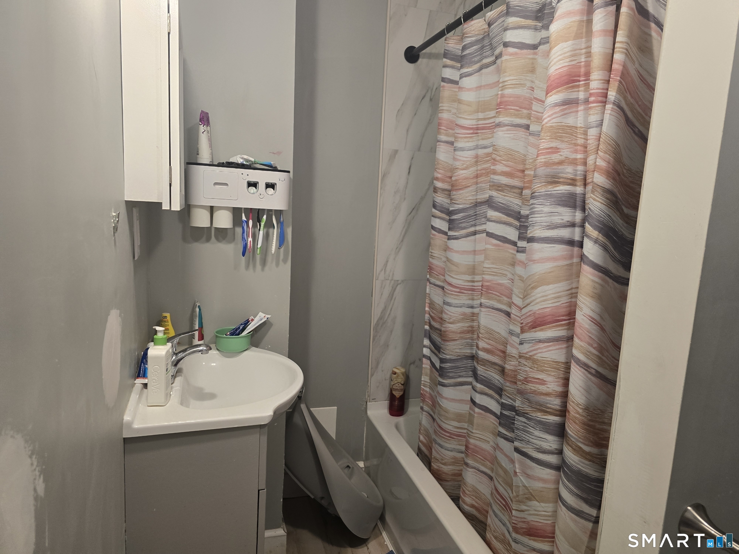 279 East Elm Street Torrington, CT 06790 - Photo 10 of 10 a bathroom with a sink and mirror