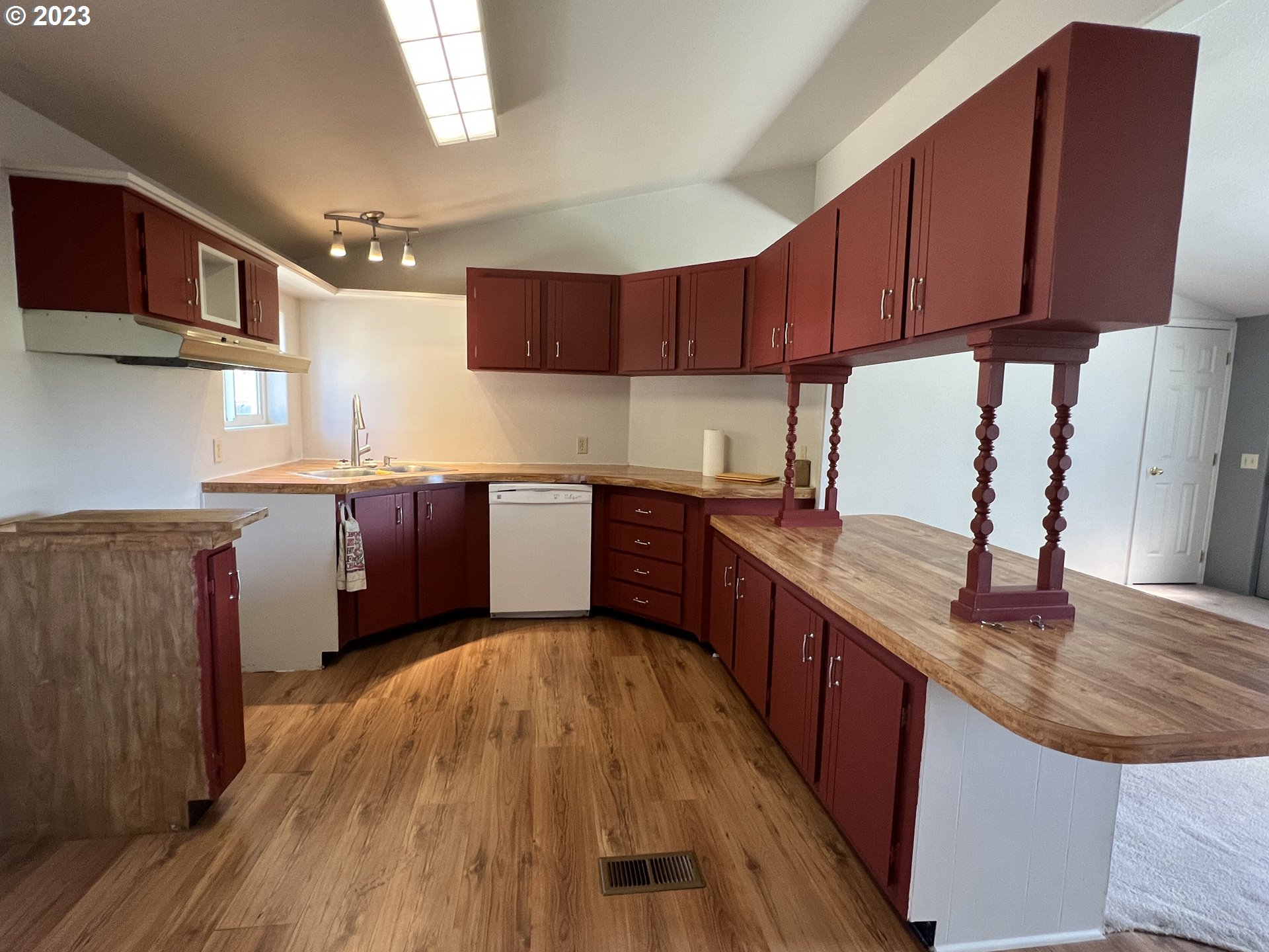 80204 South Edwards Road Hermiston, OR 97838 - Photo 19 of 27 a kitchen with stainless steel appliances granite countertop wooden cabinets a sink dishwasher a stove and a refrigerator