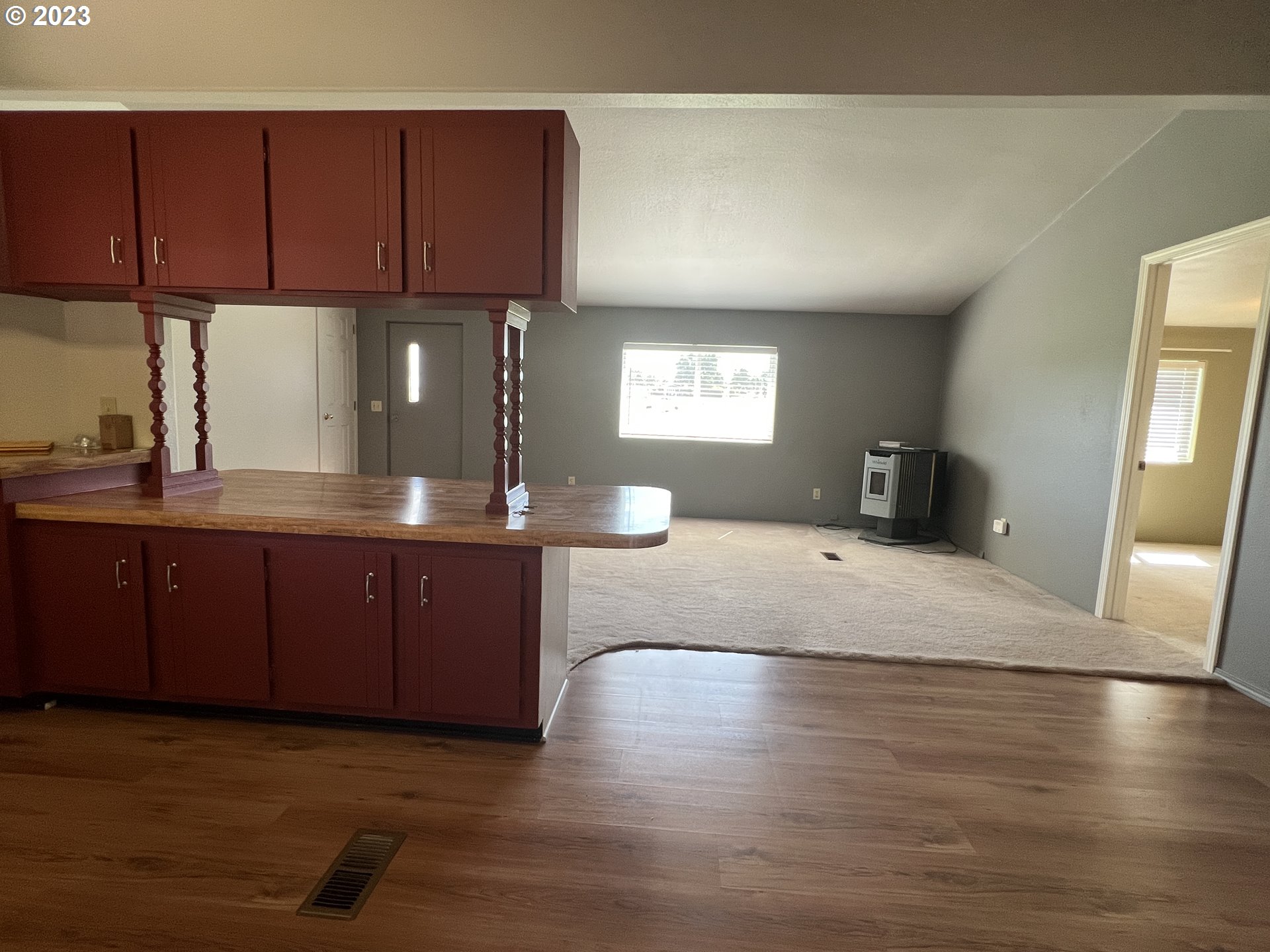 80204 South Edwards Road Hermiston, OR 97838 - Photo 20 of 27 a kitchen with stainless steel appliances granite countertop a sink a stove cabinets and wooden floor
