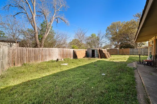 a view of a backyard of the house