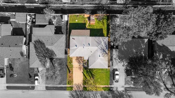 an aerial view of a house with outdoor space