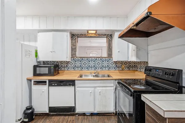 a bedroom with bed and a window