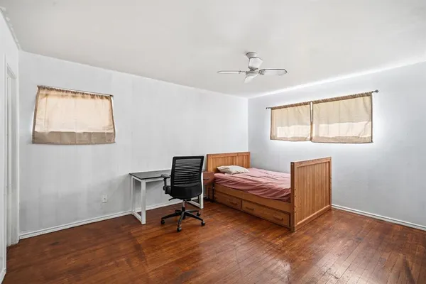 a bathroom with a toilet a sink and a mirror